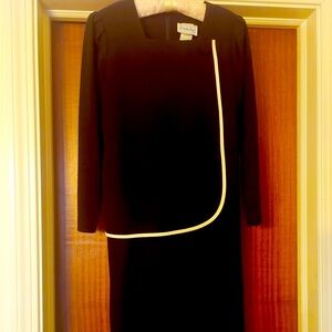 Leslie Fay 
Black wool crepe w/self fabric button & white trimmed overlay